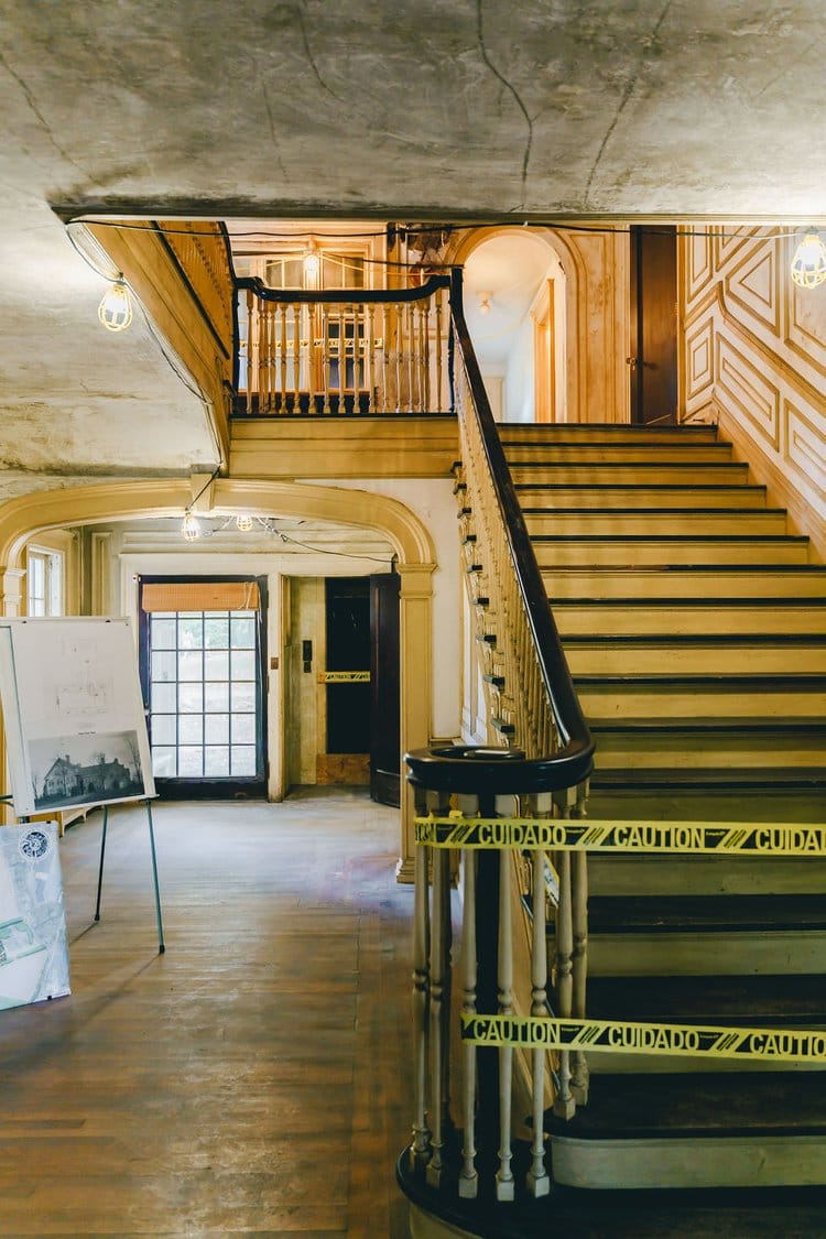 A view from the home's reception hall and up its staircase.