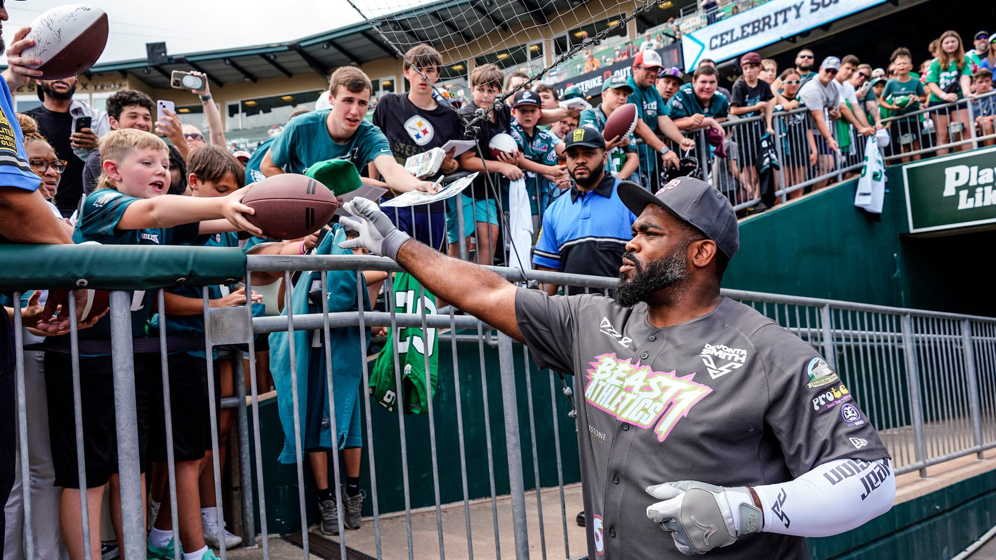 Brandon Graham signs autographs. The annual DeVonta Smith Celebrity Softball Game featuring Philadelphia Eagles and other ath
