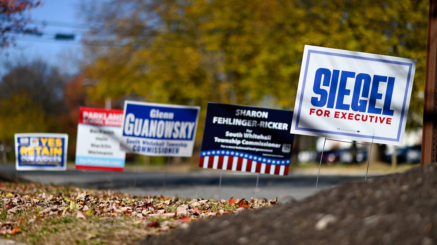 Campaign signs line the entrance to the Calvary Temple polling place on Tuesday, Nov. 4, 2025 in South Whitehall, Pa.