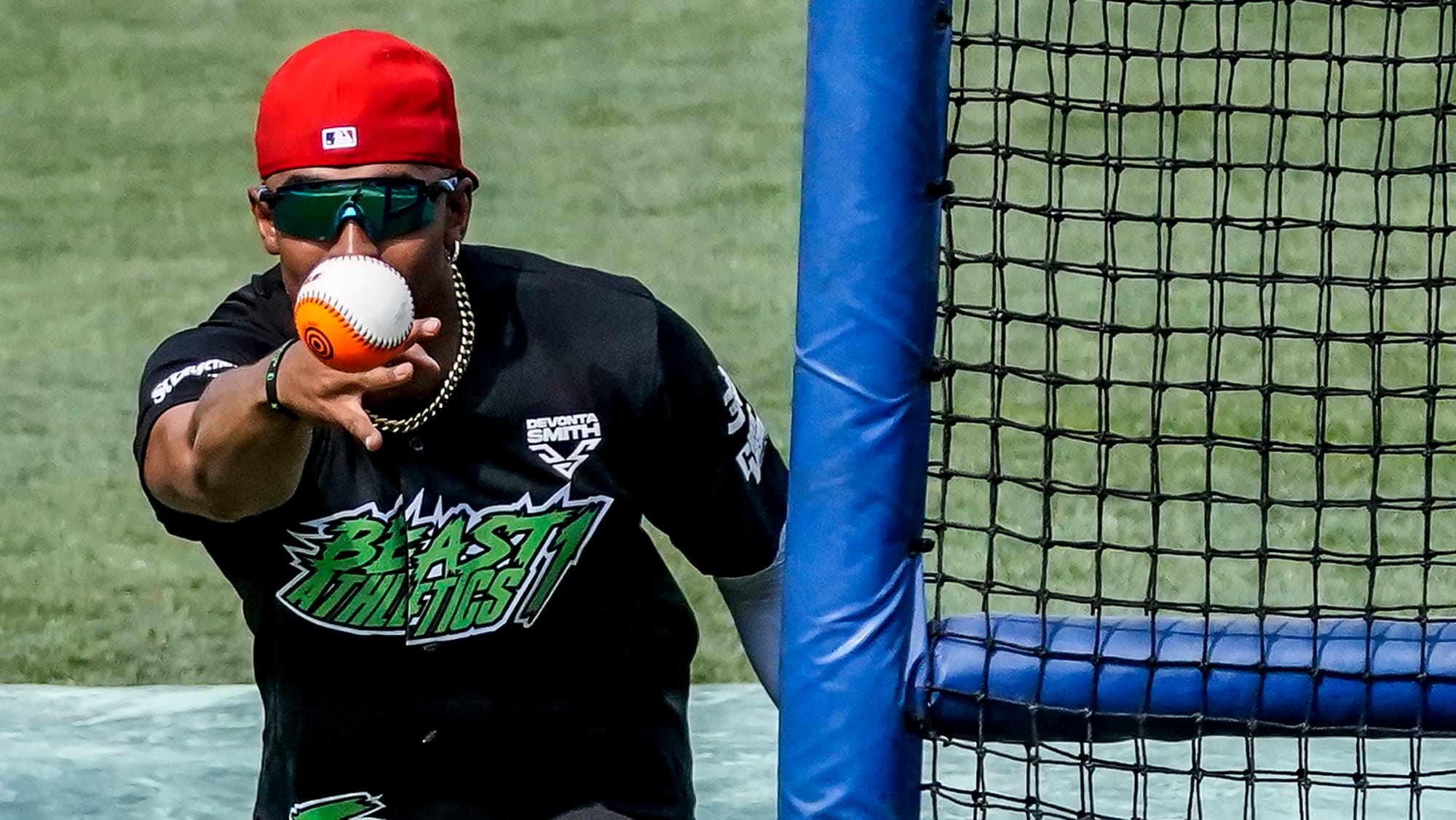 Jalen Hurts, Eagles quarterback, pitches Saturday. The 2nd annual DeVonta Smith Celebrity Softball Game was held at Coca-Cola
