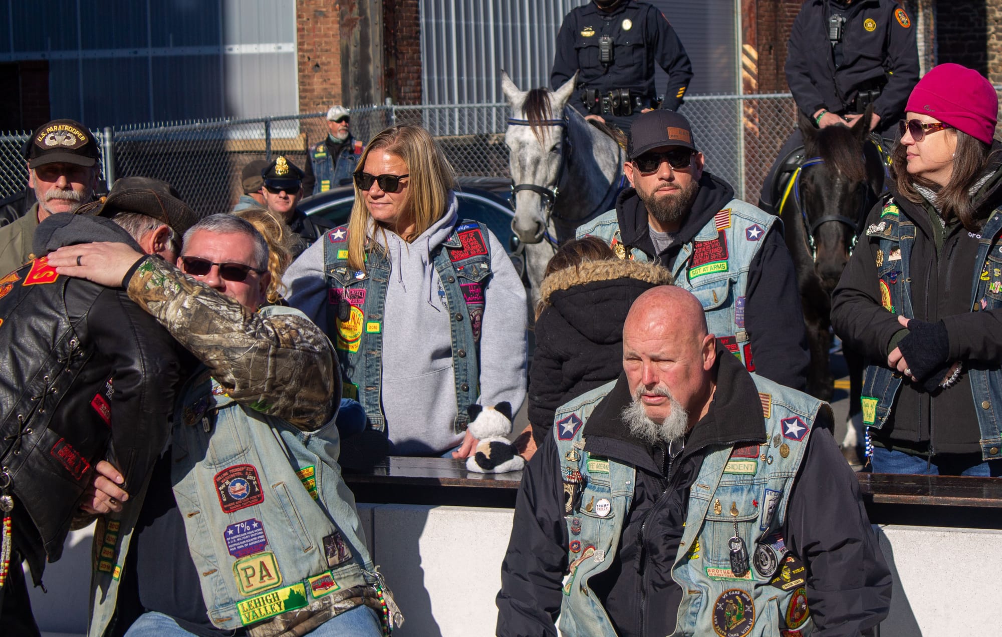 A painful day for many who served and their families; this was one of countless hugs at the ceremony.