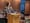 A woman standing at a podium giving a presentation.