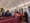 A church, about half full of people, all sitting up front