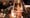 <p>A photograph of Iraq War veteran Scott Olsen is seen Thursday at a vigil. Olsen was severely injured during a standoff between police and protesters in Oakland, Calif., two days...
