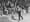 <strong>Walking The Walk:</strong> Fans look on as pedestrian Edward Payson Weston walks at a New York City roller rink in 1874. His unique stride was described as "wobbly."