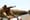 A soldier guards a pipe en route to the Kawergosk Refinery near Irbil, the capital of the autonomous Kurdish region of northern Iraq, in July. Fighting in northern Iraq forced the...