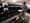 An election official gathers mail-in ballots being sorted in Chester County, Pa. Officials predict the  "overwhelming majority" of ballots will be tallied by Friday.