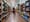 A shopper walks through a grocery store in Washington, D.C, on March 13. Surging inflation poses a particular challenge for working-class families, impacting the cost of basic nece...