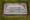The marker of the grave of a small boy whose battered body body was found abandoned in a cardboard box decades ago in Philadelphia is seen Wednesday, Dec. 7, 2022. Nearly 66 years...