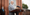 Govenor-Wolf-speaking-at-a-podium-outside-of-a-brick-building